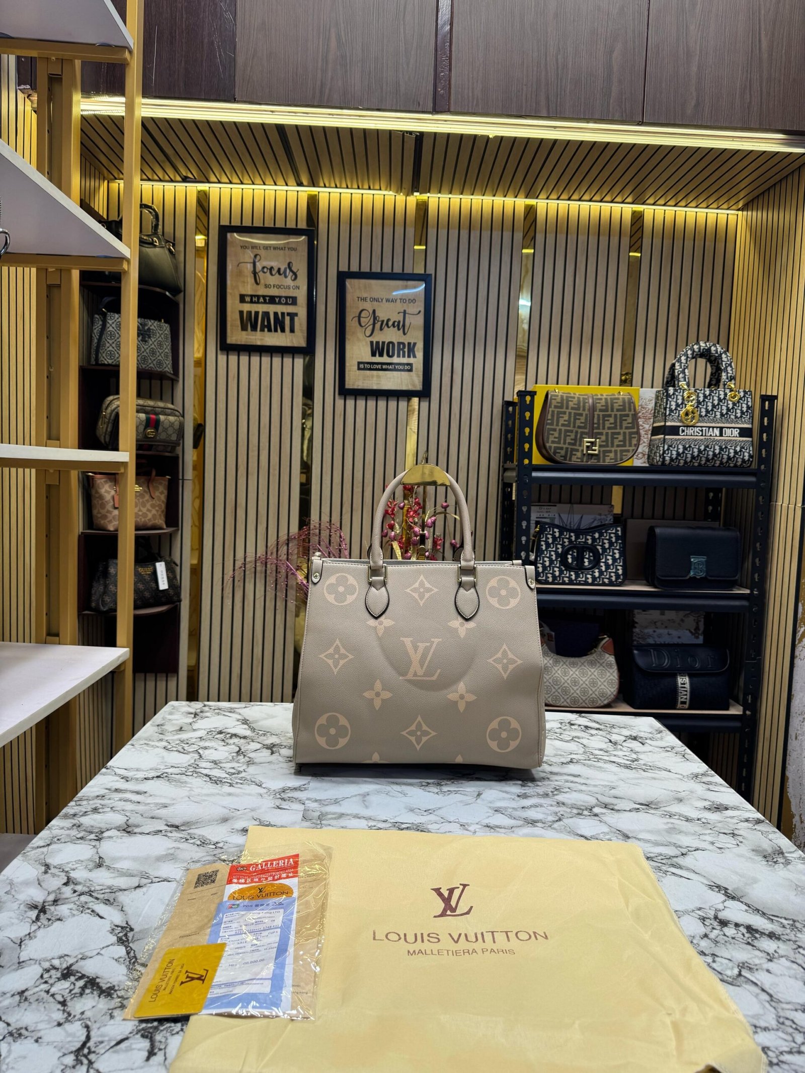 LOUIS VUITTON ON THE GO WITH ORIGINAL DUST BAG AND CARRY BAG