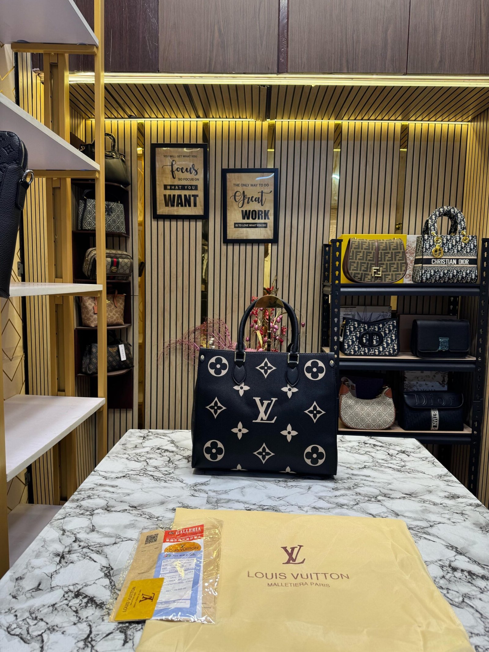 LOUIS VUITTON ON THE GO WITH ORIGINAL DUST BAG AND CARRY BAG